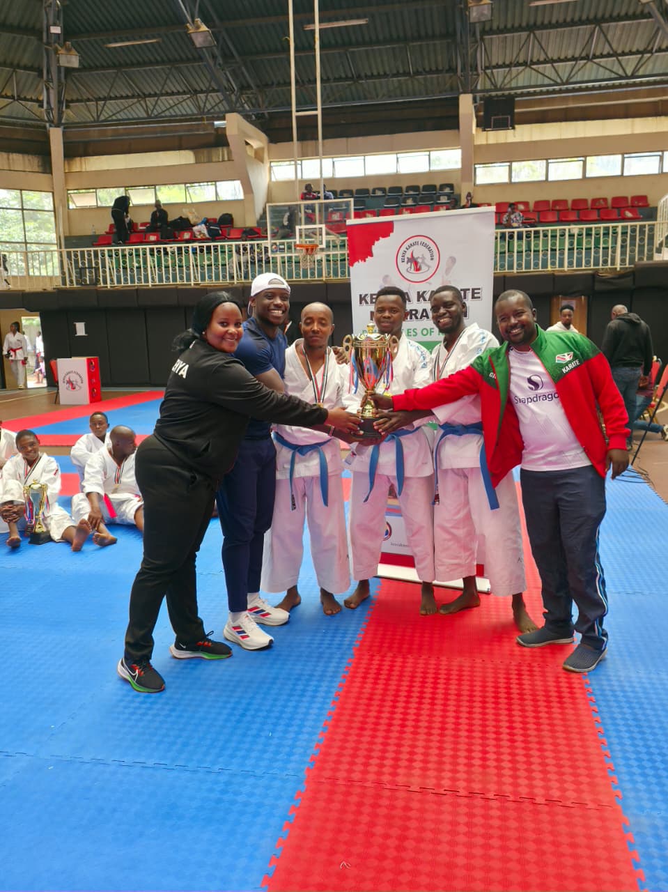 Male kata winners pose with Africa’s fastest man, Ferdinand Omanyala.