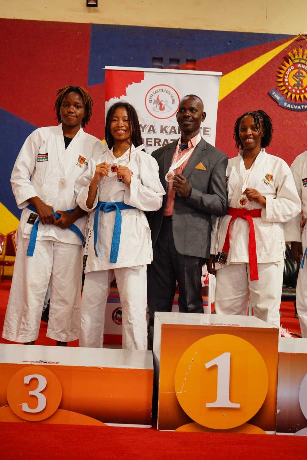 Strathmore University women’s team celebrates their victory alongside their coach at the recently concluded Kenya Open Championship.